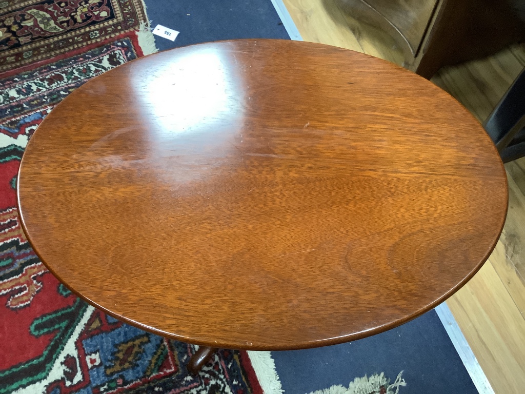 A Victorian oval mahogany occasional table, on pedestal support, width 55cm depth 39cm height 56cm